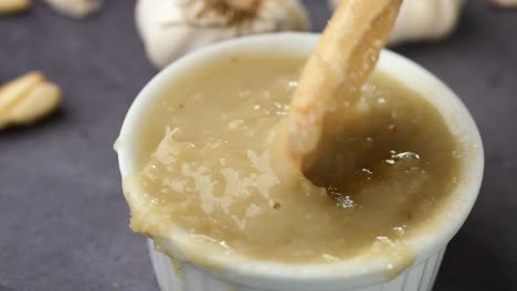 close up pf garlic paste in a container on table ,