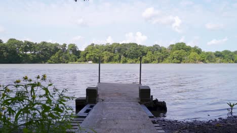 a dock looking out onto an ontario lake in summer