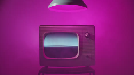 vintage television in pink background
