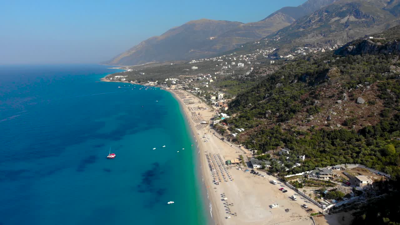 Beach resorts and touristic villages on beautiful coastline of Ionian sea, summer vacation in Albania