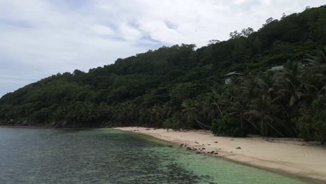 landscapes-in-Seychelles-showing-the-nature,-maountains,-ocean,-sea,-and-massive-granit-rocks-filmed-from-above-with-a-drone-in-4k-with-movement