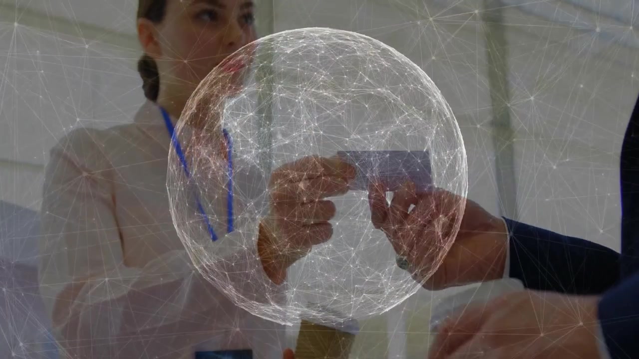 Trade show staff member extending business card when visitor reaching hand, using animated globe