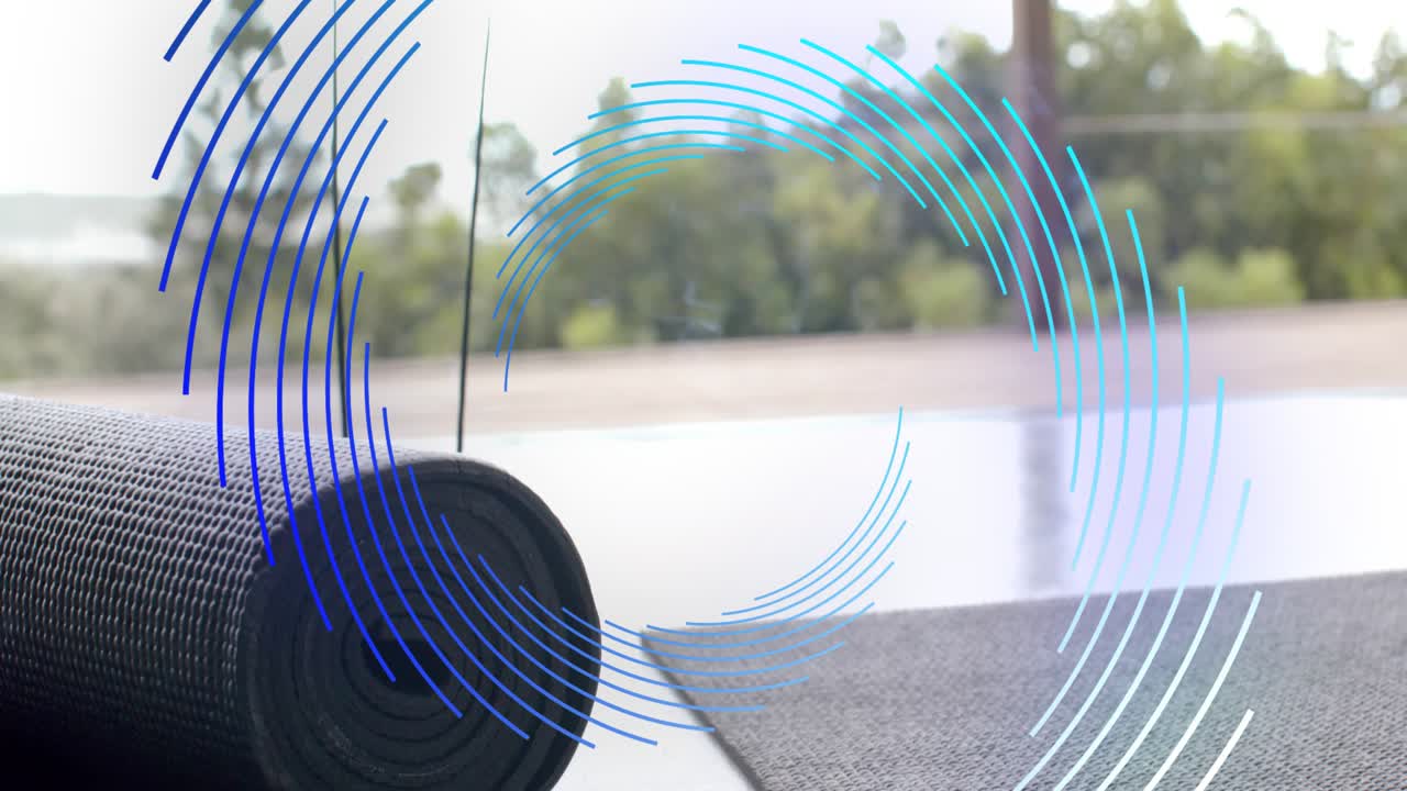 Rolled yoga mat remaining still while concentric blue rings appearing and rotating, showing texture