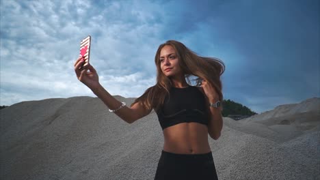 woman taking a selfie in a quarry