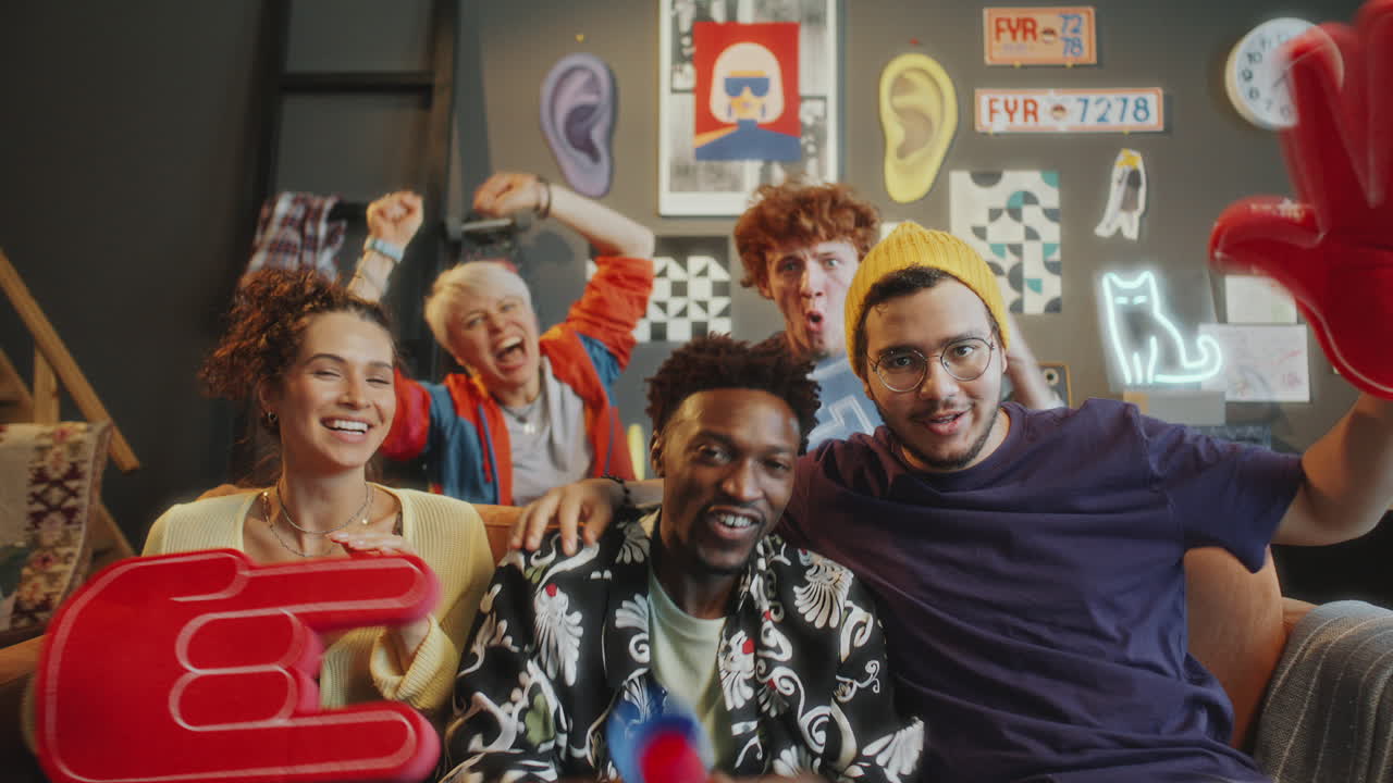 Friends Celebrating Victory while Watching TV Sports Competition at Home