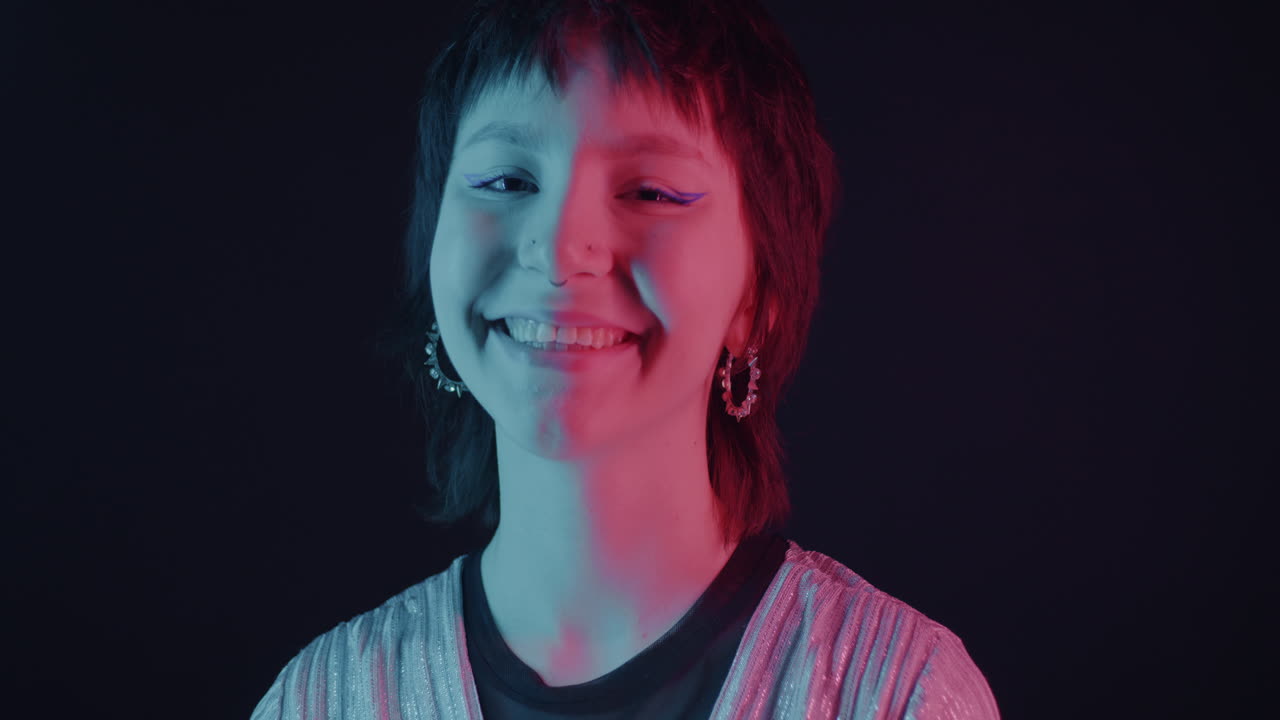 Smiling Teenager in Neon Lighting