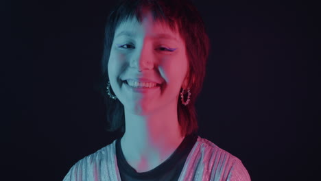 smiling teenager in neon lighting
