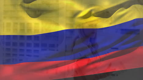 animation of flag of colombia over smiling caucasian architect holding blueprints