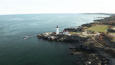 drone shot north side portland head light, fort williams park, maine