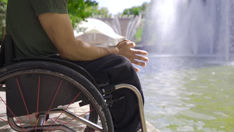 thoughtful and stressed person sitting in a wheelchair.