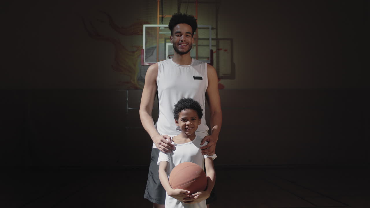 Happy Basketball Player Posing with Son