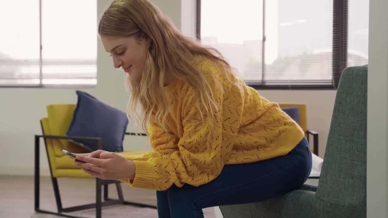 Caucasian woman typing on her phone