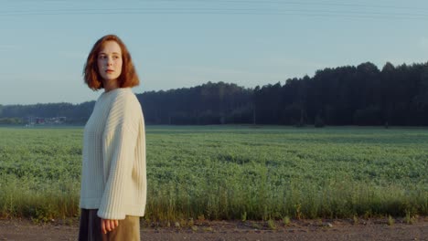 woman in a field at sunrise