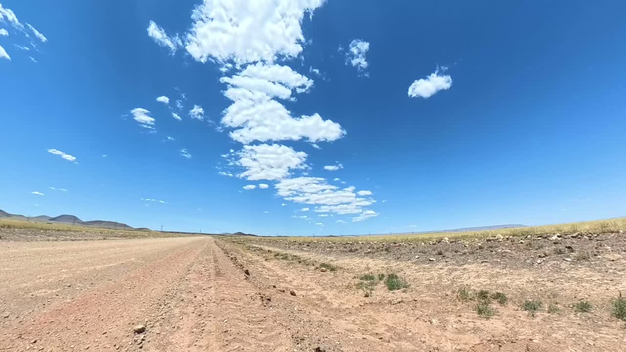Desert open road time lapse of clouds forming in condensation