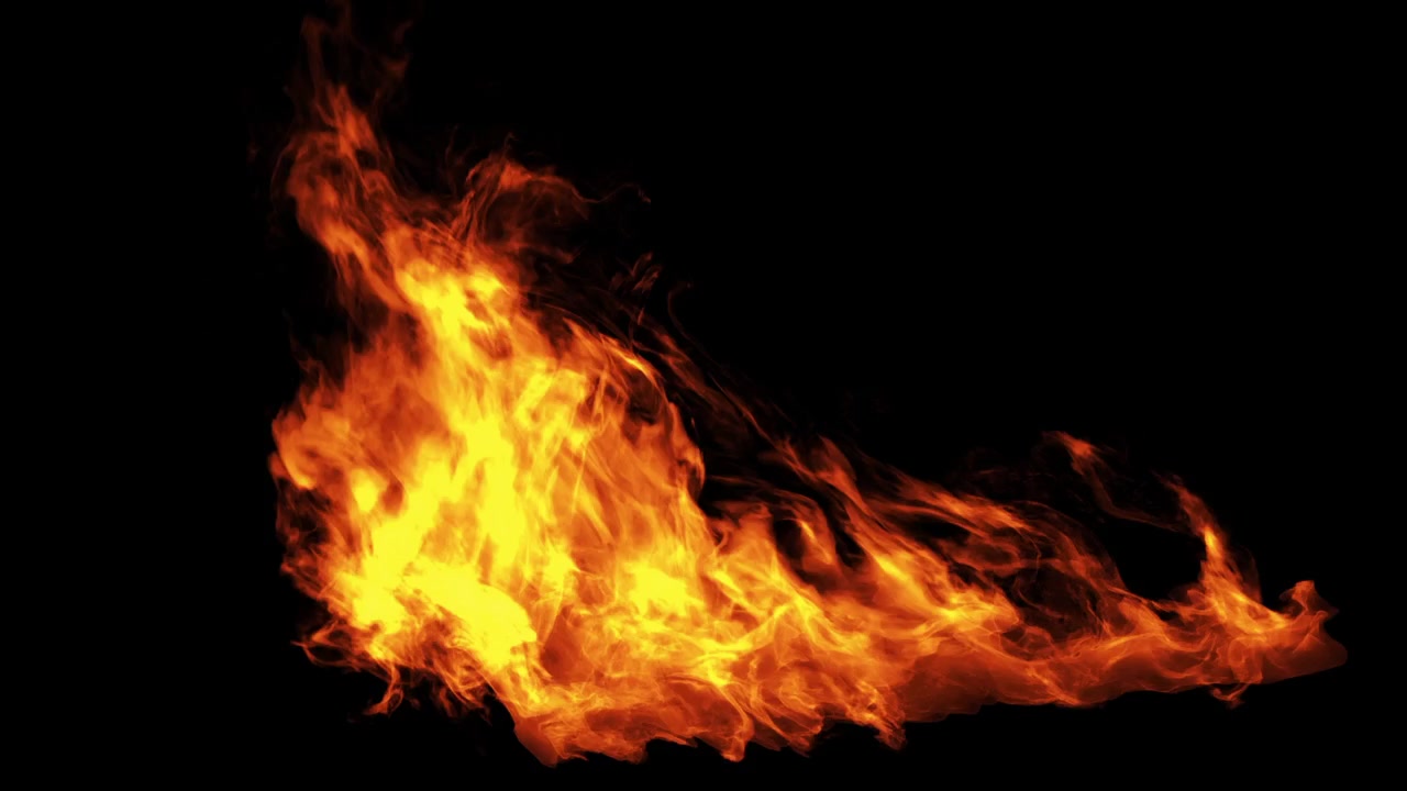 Klare orange flammer bryder frem mod en sort baggrund