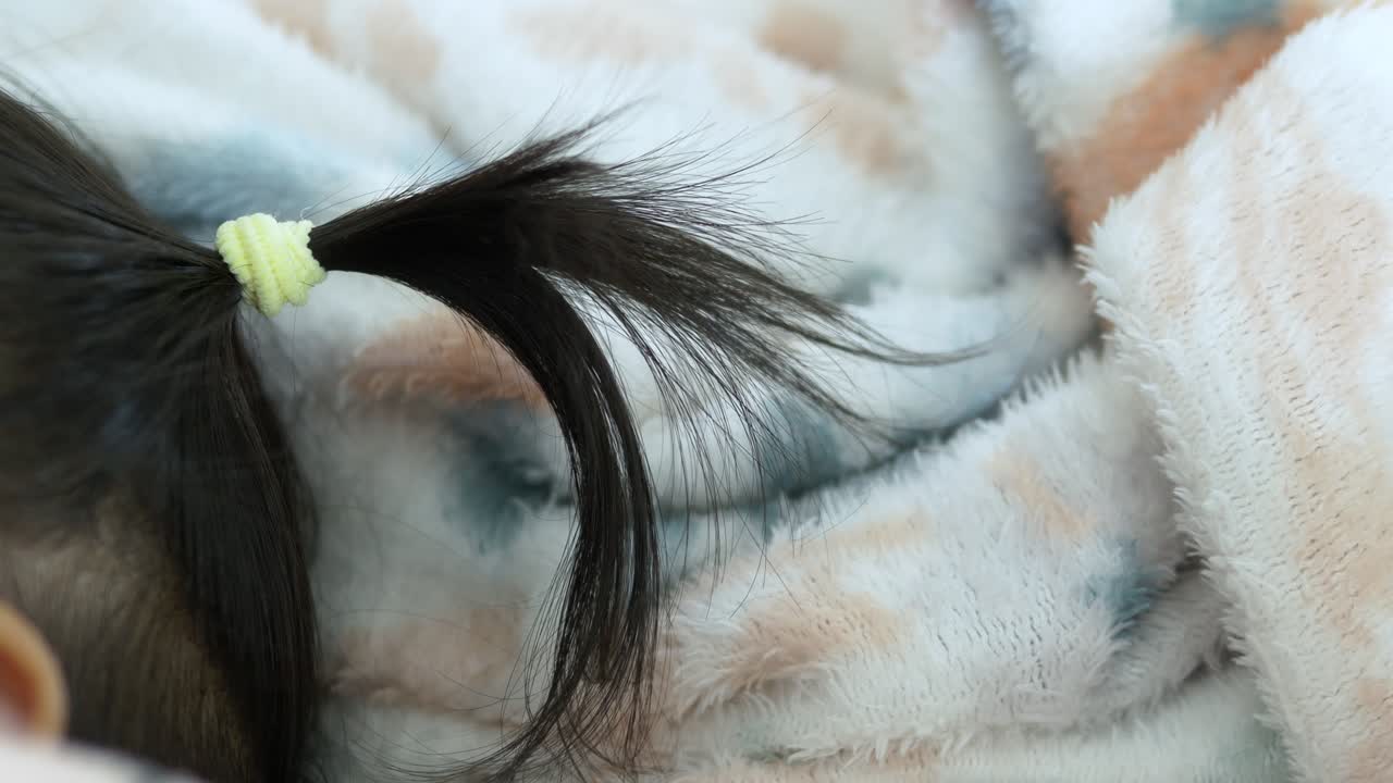 A peaceful moment captures a baby resting comfortably a cozy blanket showcasing tranquility and warmth
