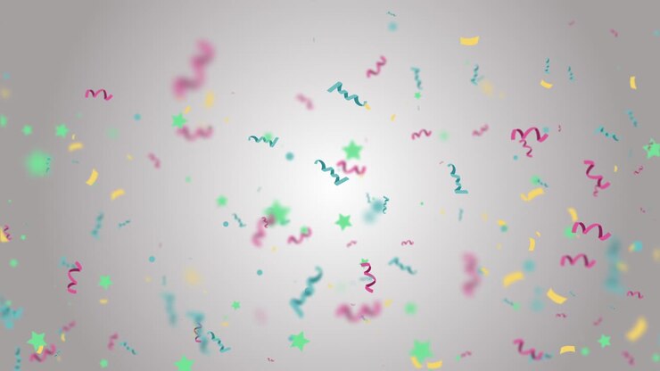 Confetti colorati che cadono al rallentatore su uno sfondo chiaro