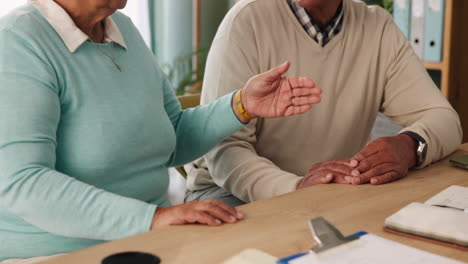elderly couple discussing financial matters
