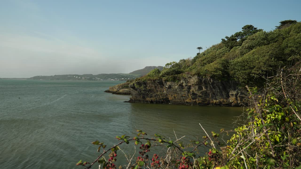 View Of River Dwyryd From Portmeirion Village With Hills And Cliffs In Background, North Wales, UK