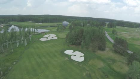 golf course aerial view with hot air balloon