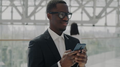 businessman texting in modern office