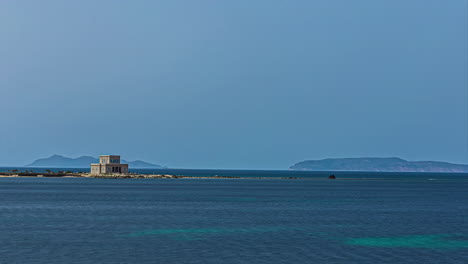 Static-view-of-an-old-house-along-the-seashore-of-the-Sicily-in-province-of-Trapani,-Italy-throughout-the-day-in-timelapse