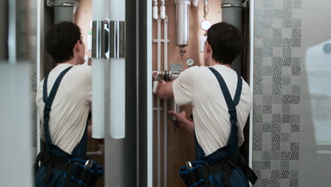 plumber fixing water tubes