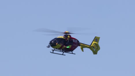 a helicopter flying steadily in a clear sky