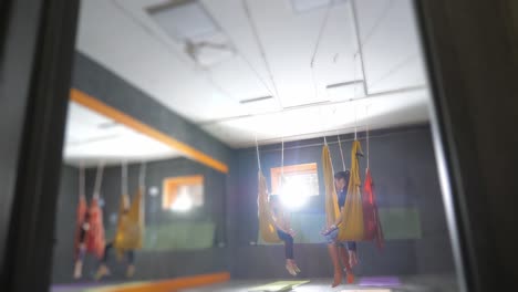 aerial yoga class in a studio