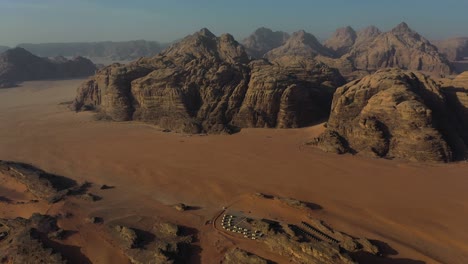 Camping-resort-in-Wadi-Rum-landscape,-Jordan,-aerial-panorama