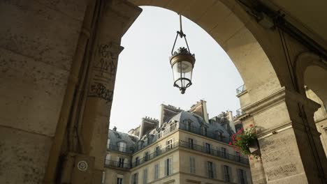 parisian archway with historic lamp