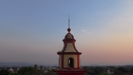 bell tower of the church of tlaltenango during the spectacular sunset in ascending perspective