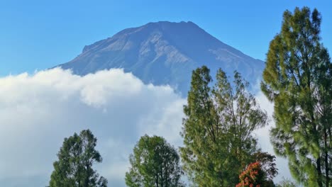 beautiful view of mount sumbing when the sky is blue and clouds