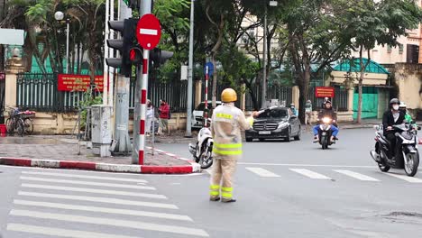 traffic officer directing vehicles at busy intersection