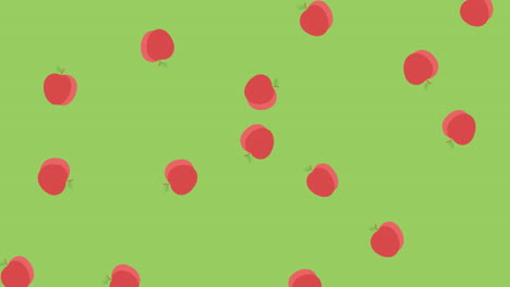 animation of multiple red apples rotating and falling on green background