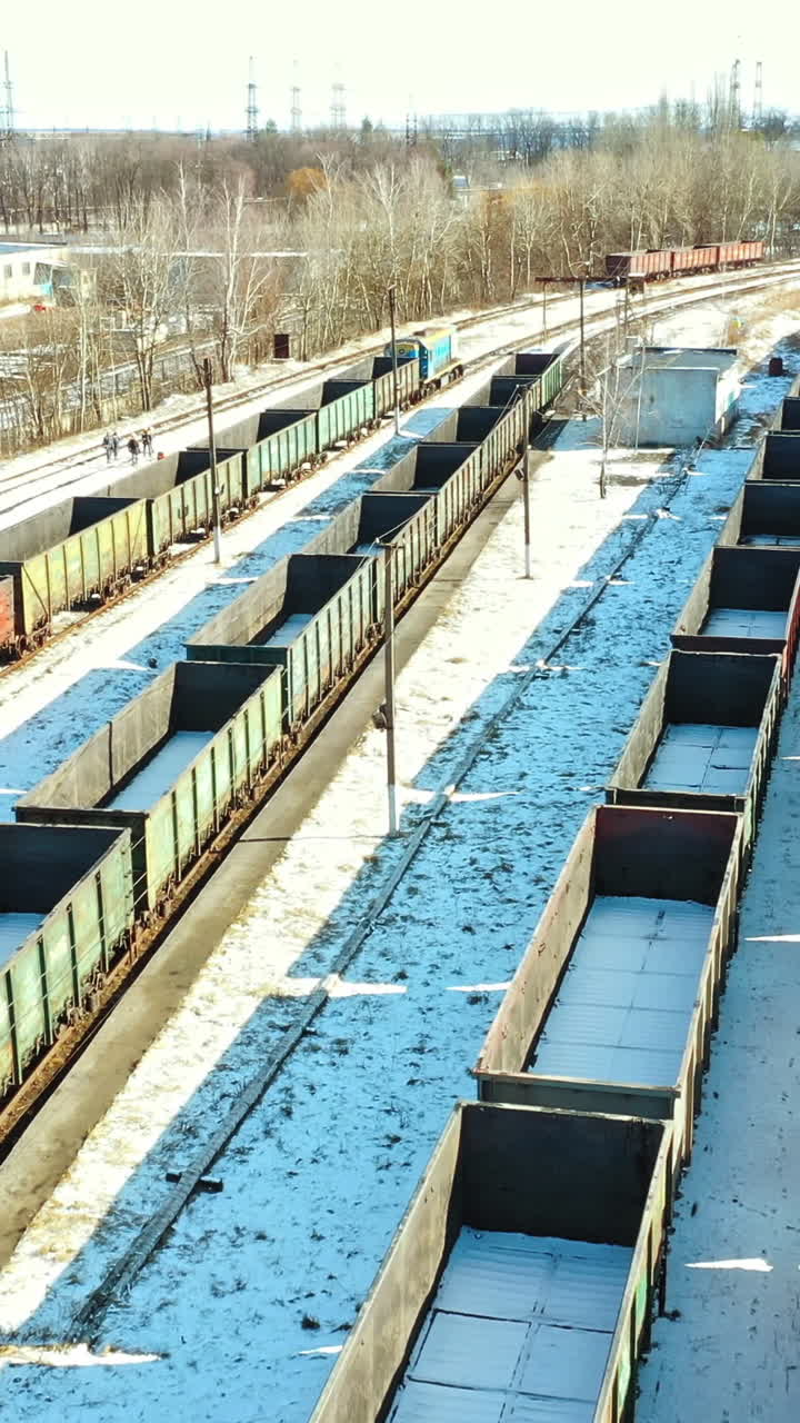 Railway station of freight trains. Cargo train platform with freight train container at depot. Vertical video