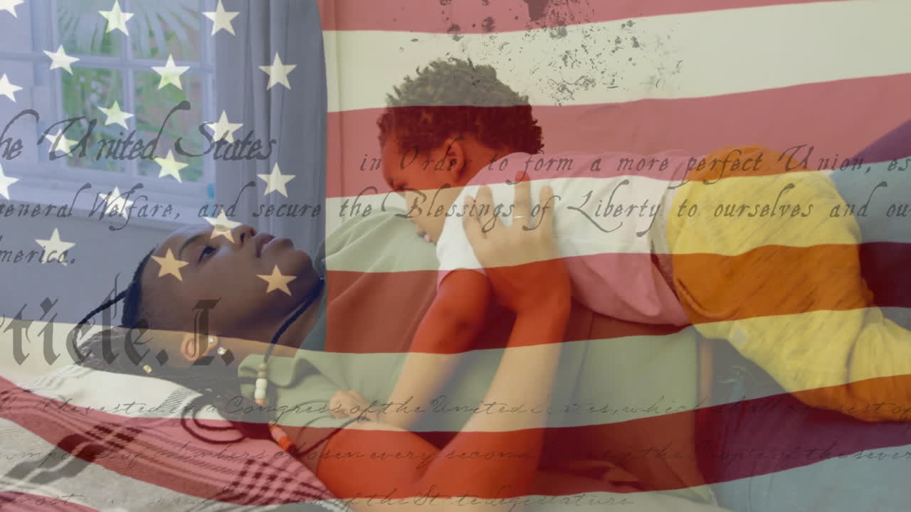 Biracial children with US flag waving and constitution foreground