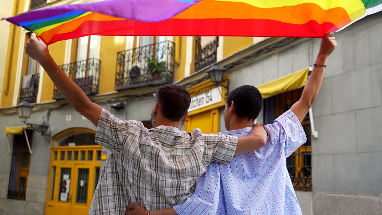 Couple Celebrating Pride with Rainbow Flag