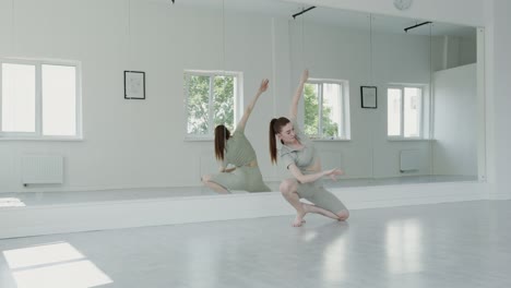 young woman doing yoga in studio