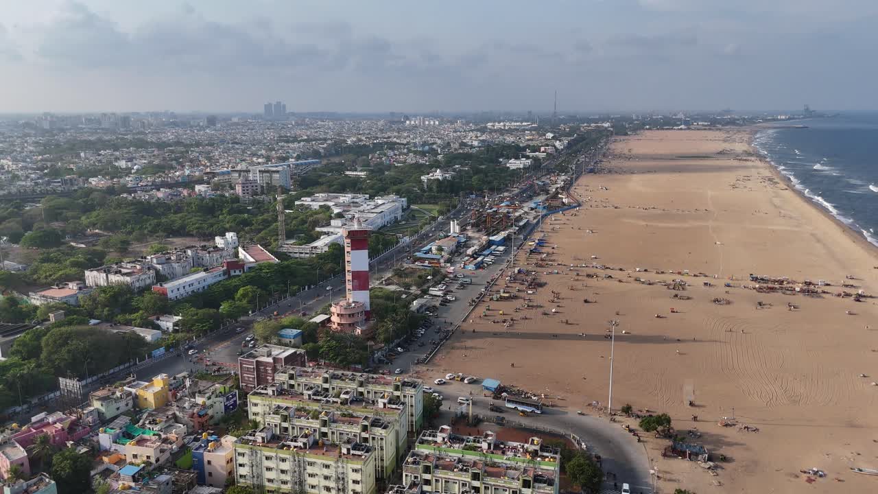 Capturing the resilience and daily life of communities in slum settlements near Marina's lighthouse from the sky.