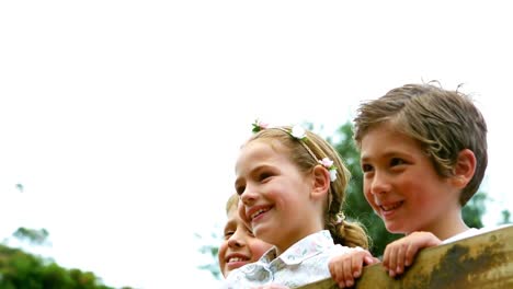 kids standing on a playground ride in park
