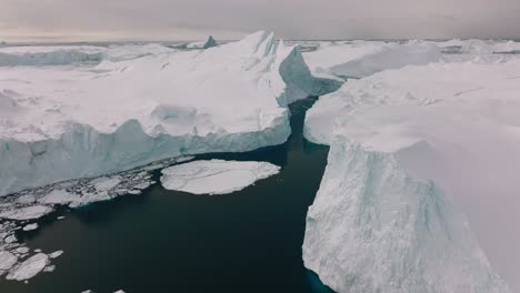 drone over sea and ice of ilulissat icefjord