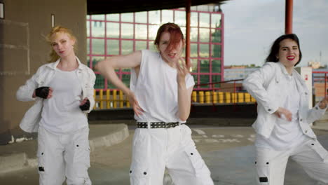 Young-dancers-performing-in-white-outfit-outdoors