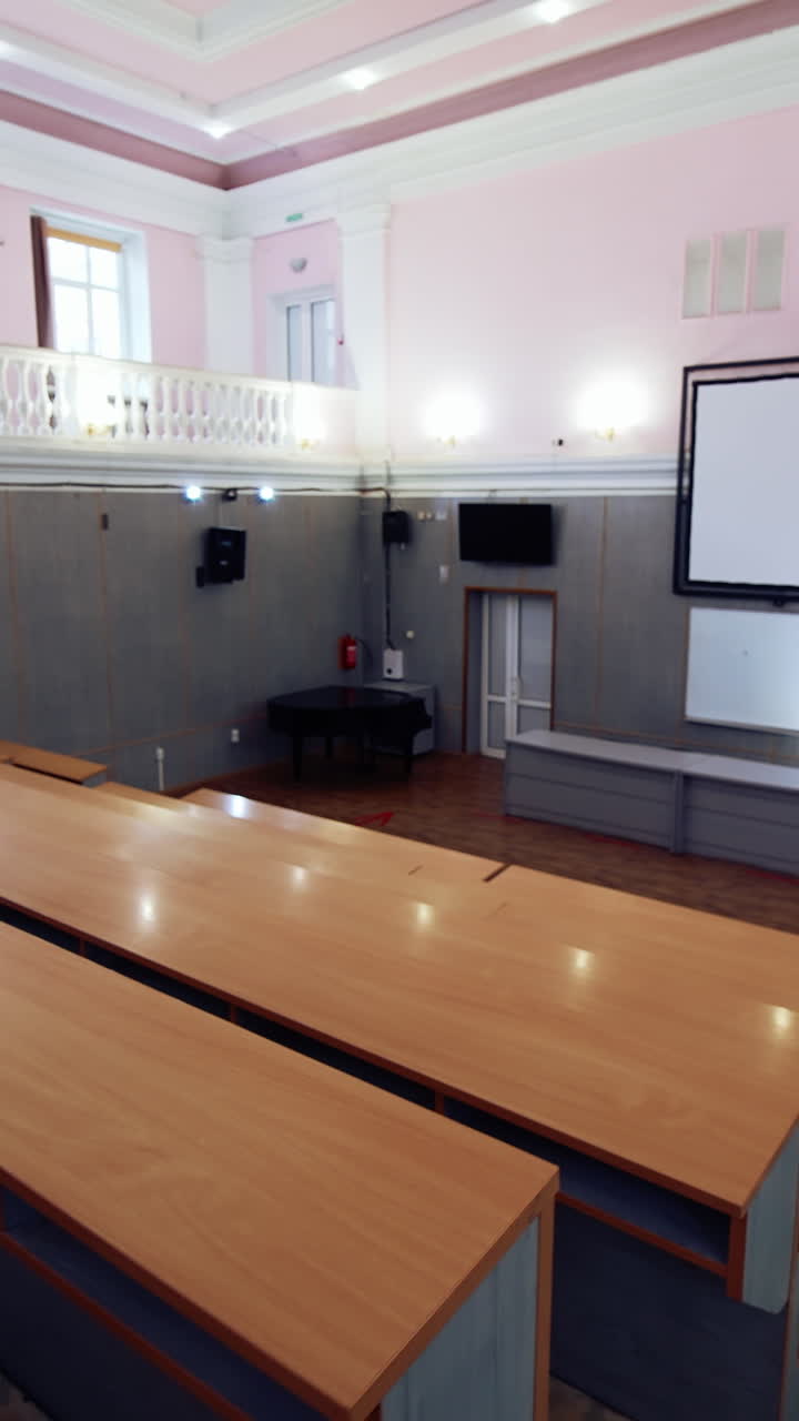 Empty big modern education room. Conference lecture room with empty audience. Vertical video