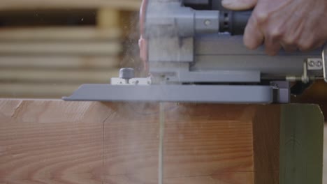 slow motion shot of hand cutting wood carefully