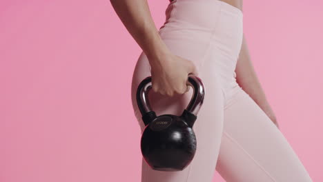 woman exercising with kettlebell