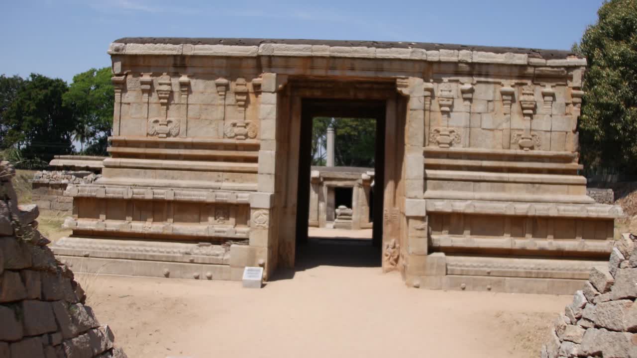 Walking Towards The Entrance Of Underground Shiva Temple In Hampi, Karnataka, India - forwarding shot