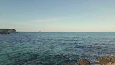 Explore the breathtaking beauty of Cala Torta and Cala Mesquida in Majorca. Enjoy the serene coastline, gentle waves, and vibrant sea under a clear sky. Perfect for nature lovers.