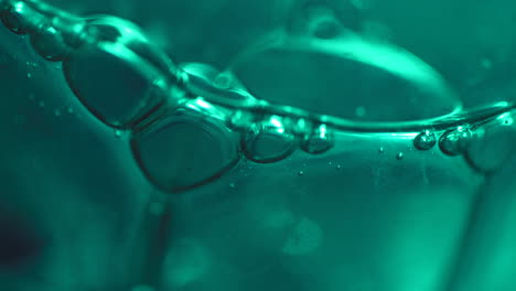 Slow-Moving-Dark-Green-Bubbles-in-Abstract-Macro-Background