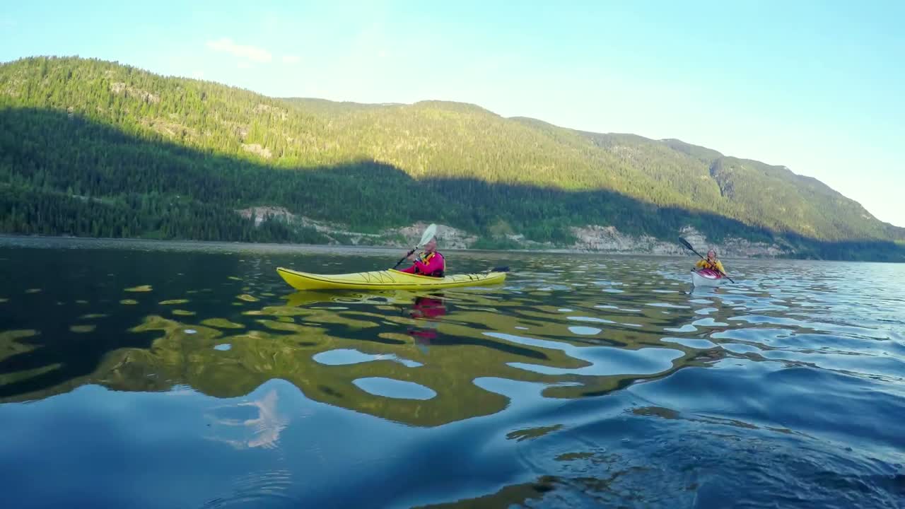 Tourist rowing a boat in the river 4k